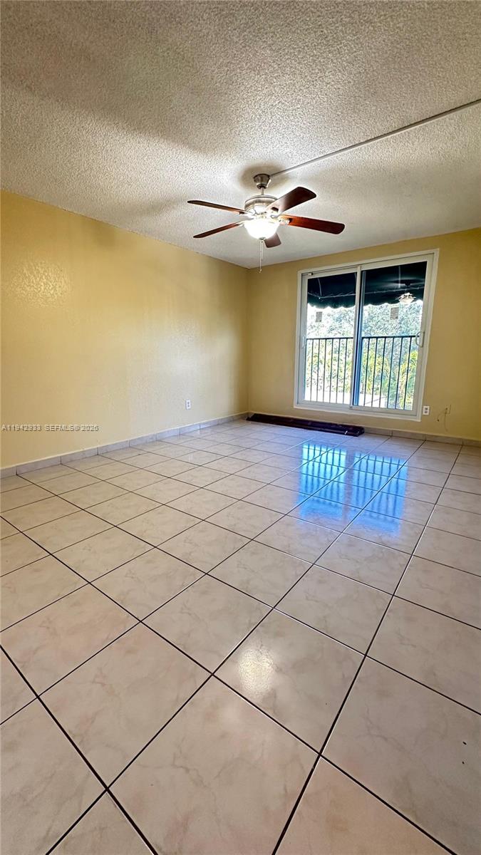 606 West 81st Street, Unit 305 Hialeah, FL 33014 - Photo 4 of 11 a view of an empty room with a window