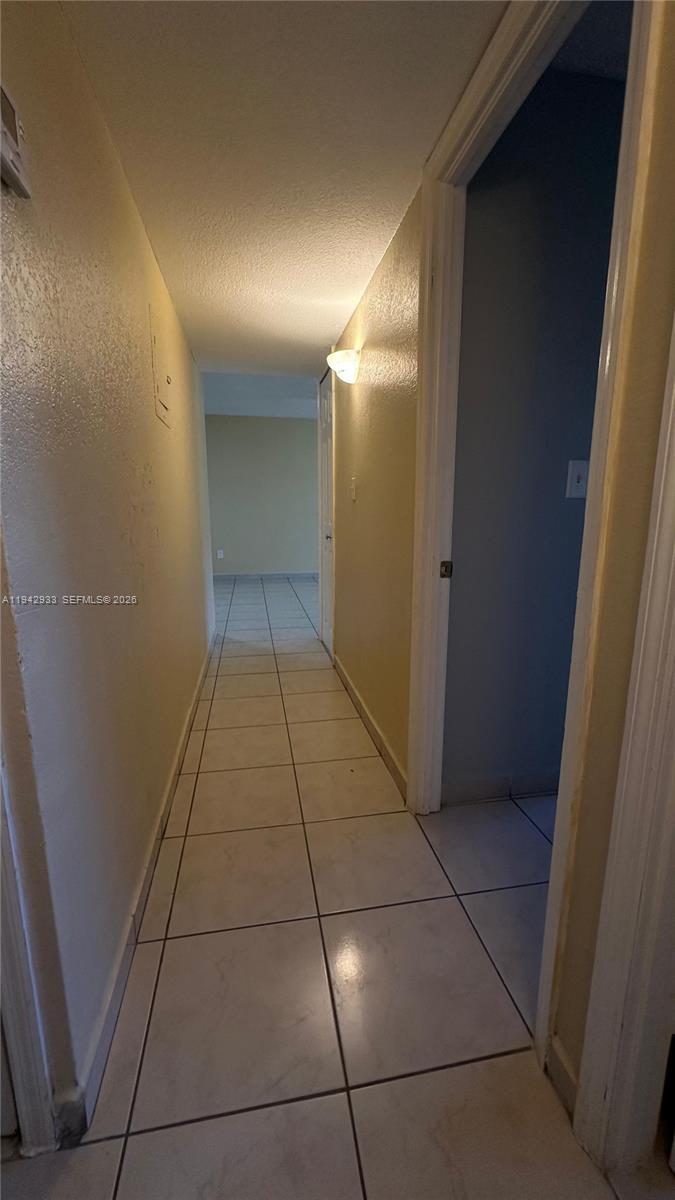 606 West 81st Street, Unit 305 Hialeah, FL 33014 - Photo 5 of 11 a view of a hallway