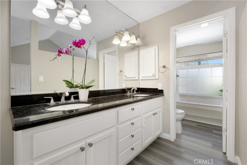 7 Hancock Irvine, CA 92620 - Photo 21 of 46 a bathroom with a sink vanity and a mirror