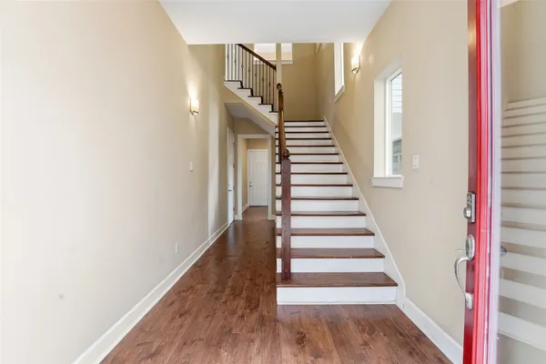 a view of entryway with wooden floor