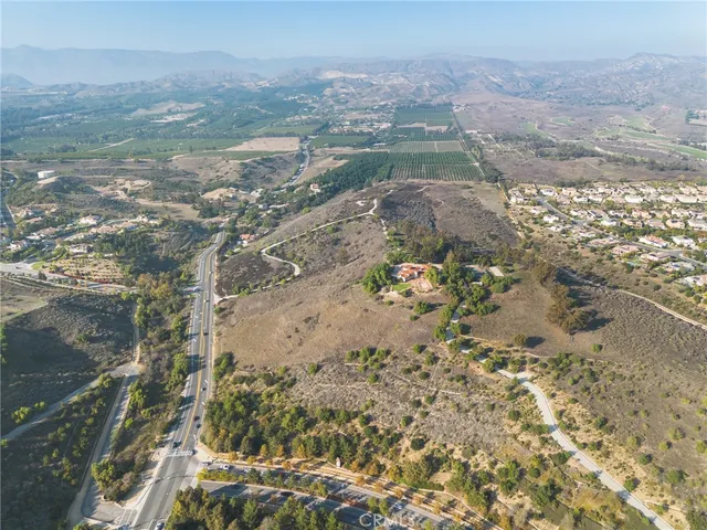 a view of mountains with green field