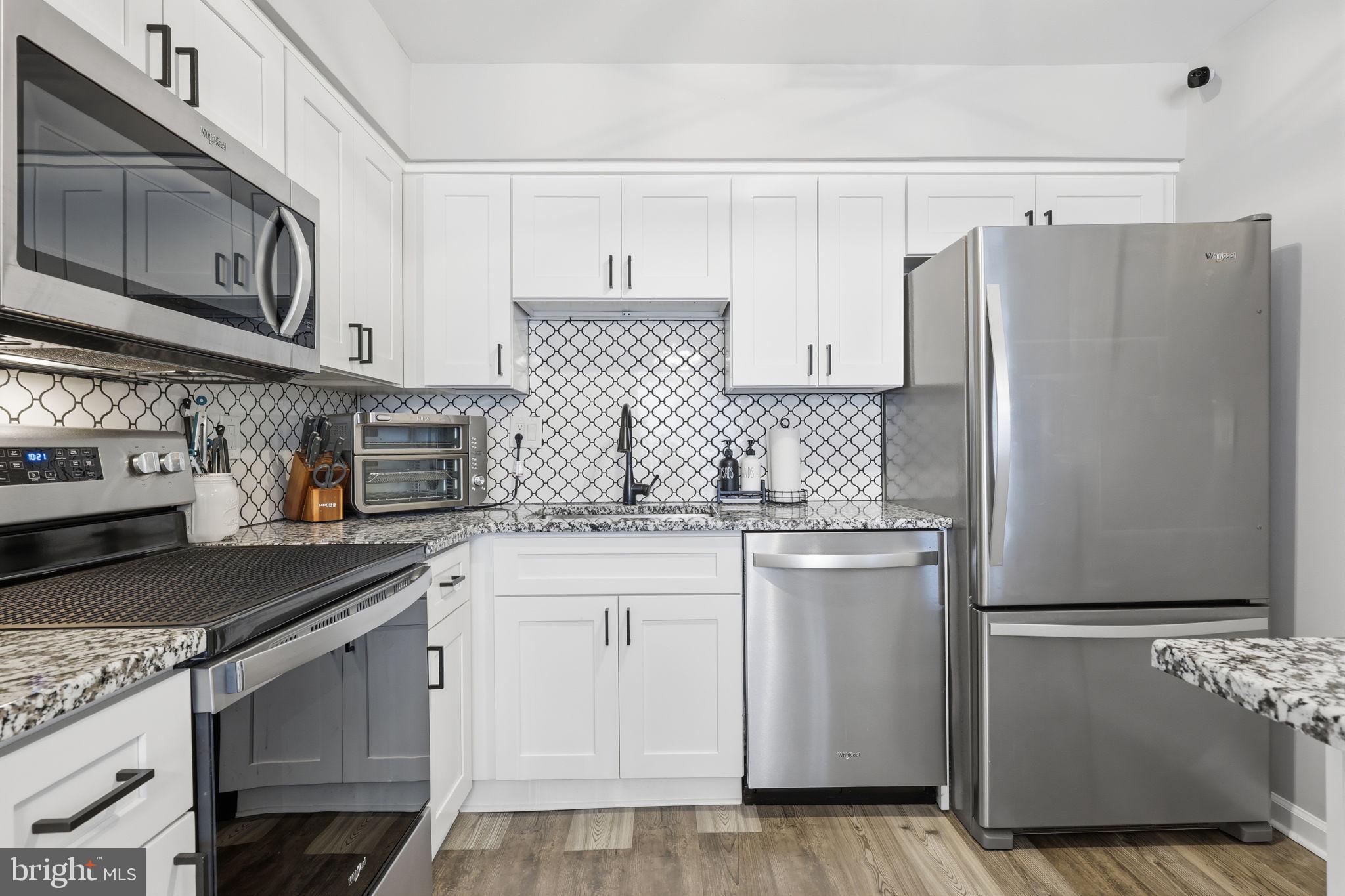 22 Fitzwatertown Road, Unit C7 Willow Grove, PA 19090 - Photo 4 of 33 Sleek modern kitchen with stylish finishes.