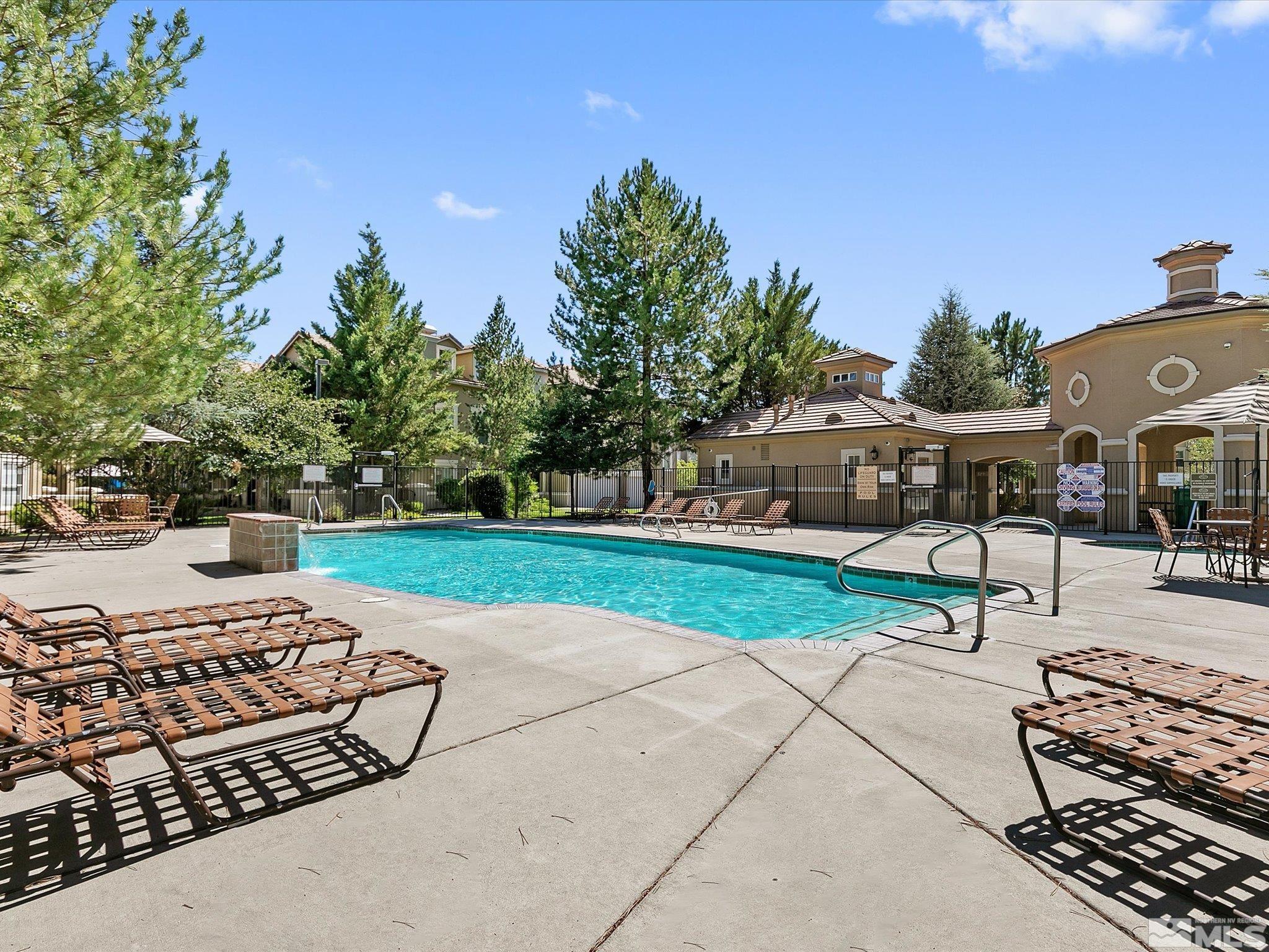 9050 Double R Boulevard, Unit 923 Reno, NV 89521 - Photo 3 of 10 a view of a backyard with a bench