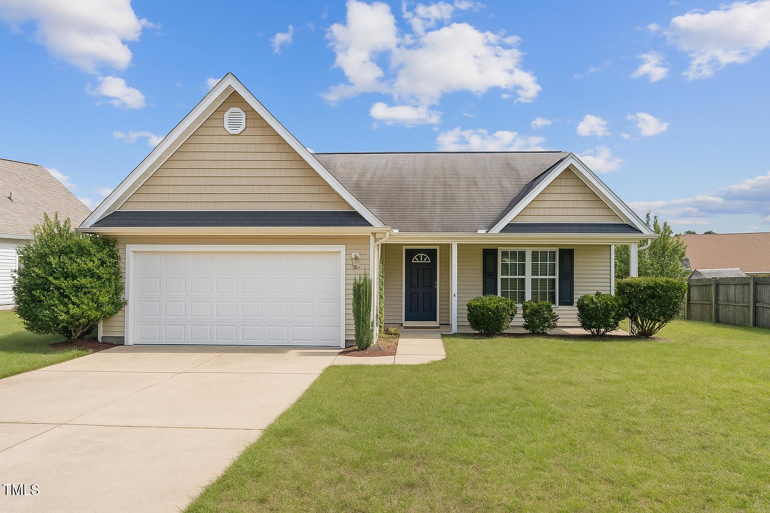 2513 Hunting Bow Drive Hope Mills, NC 28348 - Photo 1 of 39 a front view of a house with a yard outdoor seating and garden