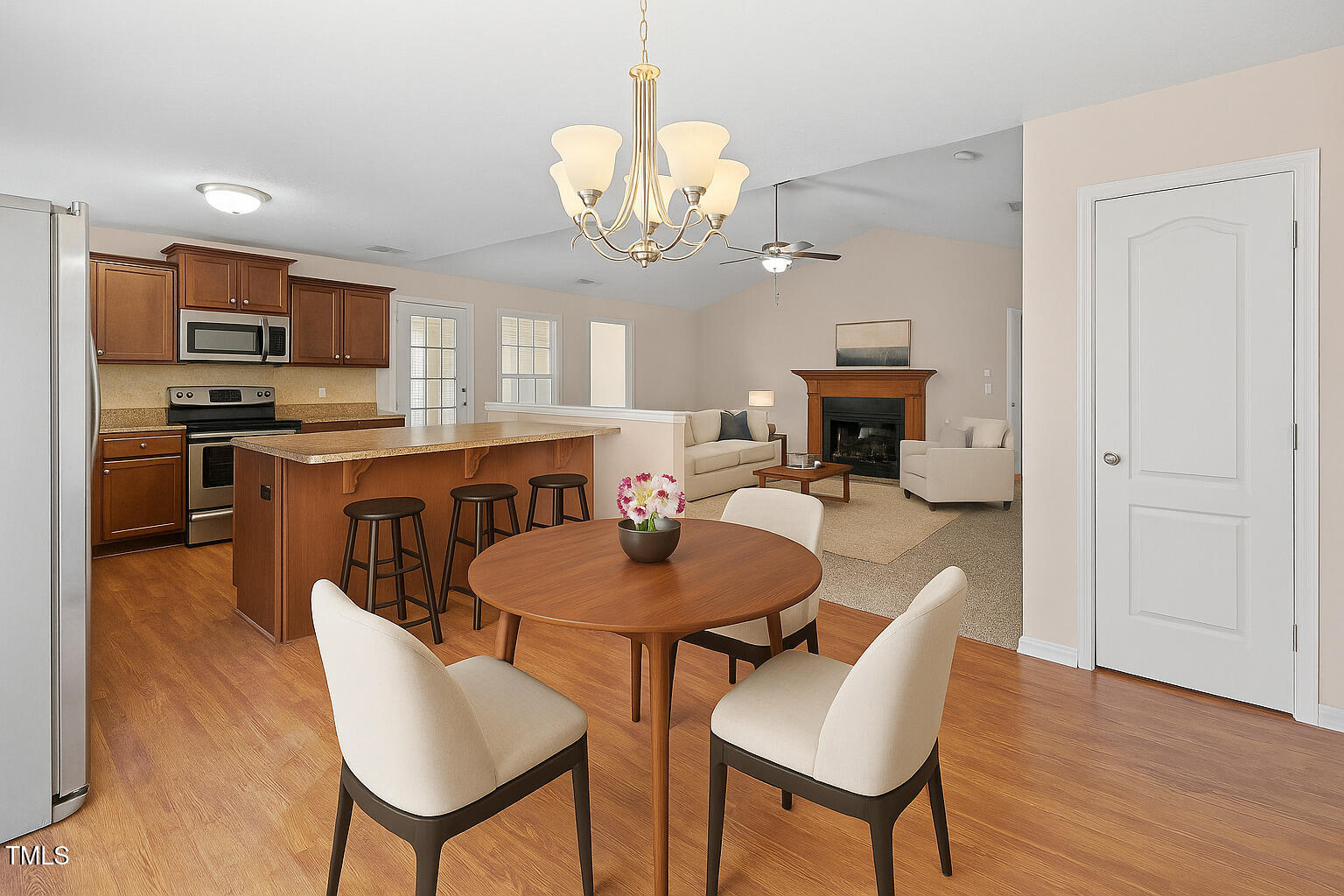 2513 Hunting Bow Drive Hope Mills, NC 28348 - Photo 13 of 39 a dining room with wooden floor a chandelier a wooden table and chairs