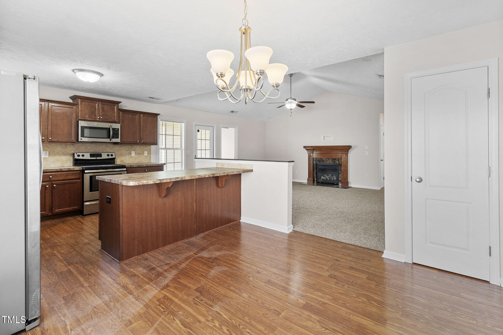 2513 Hunting Bow Drive Hope Mills, NC 28348 - Photo 14 of 39 a kitchen with stainless steel appliances granite countertop a stove top oven a sink dishwasher and a microwave oven on the blue kitchen countertops