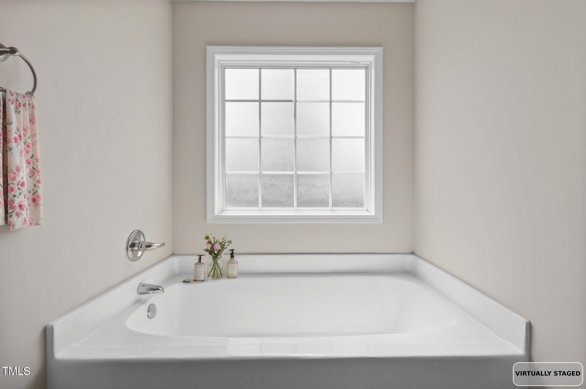 2513 Hunting Bow Drive Hope Mills, NC 28348 - Photo 23 of 39 a white bath tub sitting in a bathroom next to a window