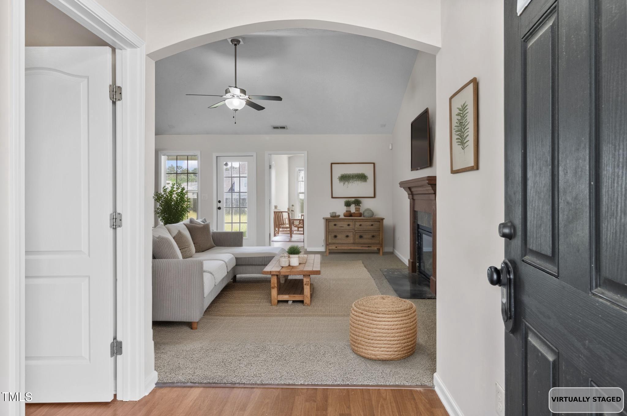2513 Hunting Bow Drive Hope Mills, NC 28348 - Photo 2 of 39 a living room with furniture and a chandelier