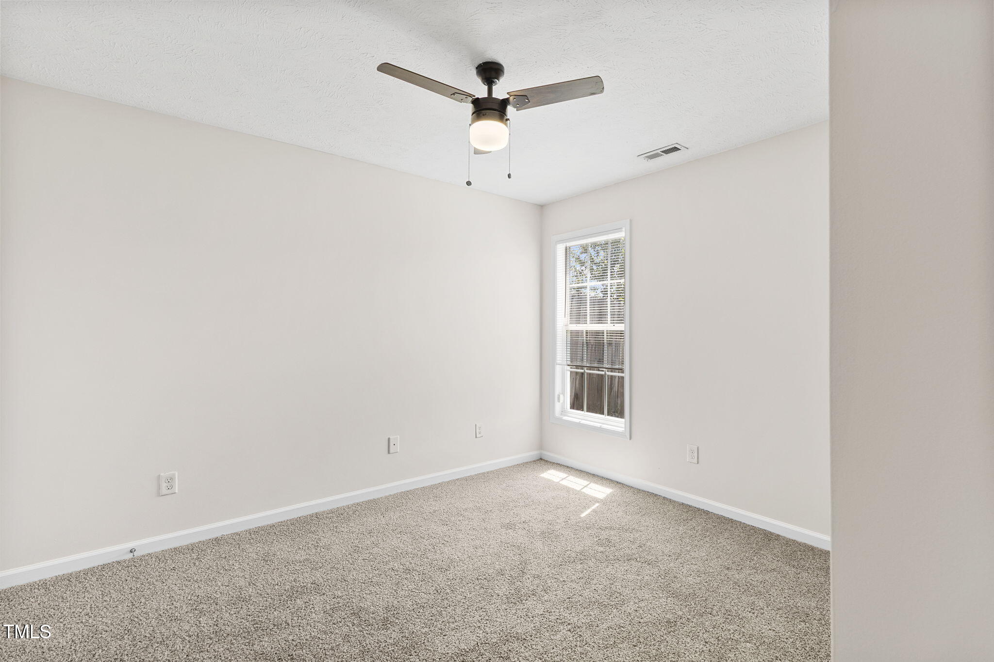 2513 Hunting Bow Drive Hope Mills, NC 28348 - Photo 30 of 39 an empty room with ceiling fan and windows