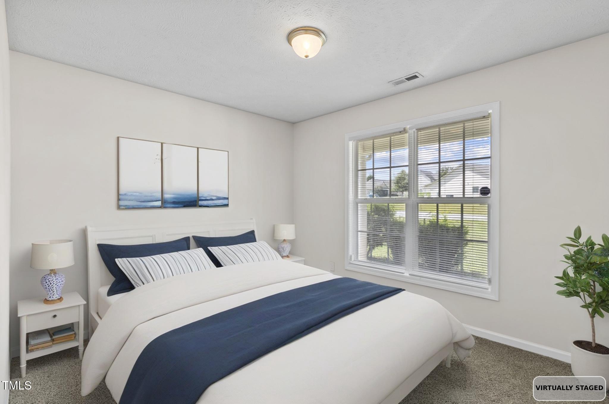2513 Hunting Bow Drive Hope Mills, NC 28348 - Photo 31 of 39 a bedroom with a balcony and large window