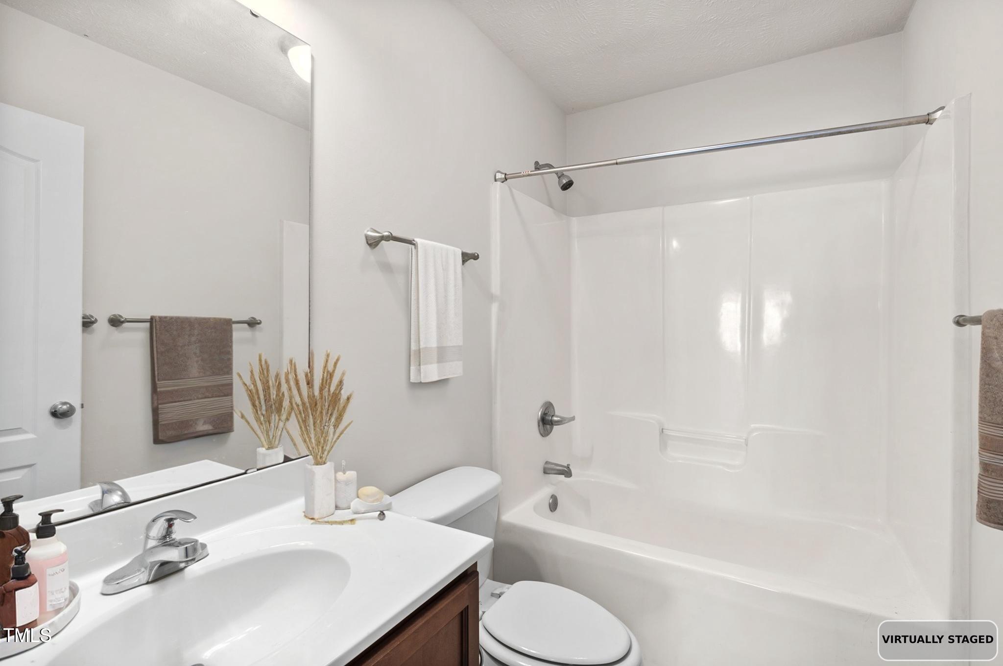 2513 Hunting Bow Drive Hope Mills, NC 28348 - Photo 33 of 39 a bathroom with a sink toilet tub and shower