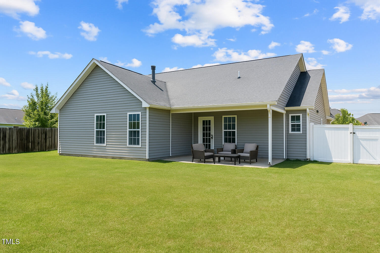 2513 Hunting Bow Drive Hope Mills, NC 28348 - Photo 36 of 39 a view of a house with a yard and sitting area