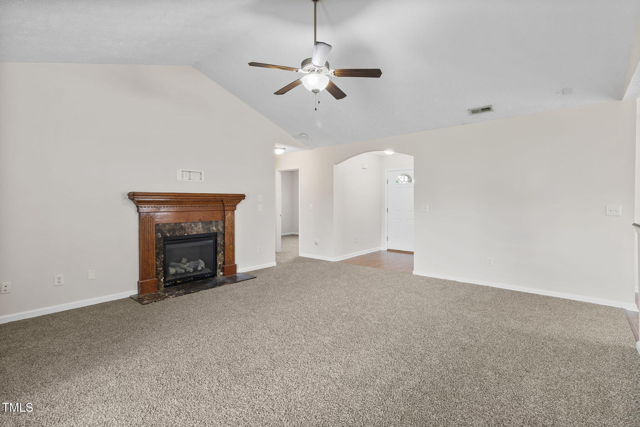2513 Hunting Bow Drive Hope Mills, NC 28348 - Photo 5 of 39 a view of an empty room with a fireplace