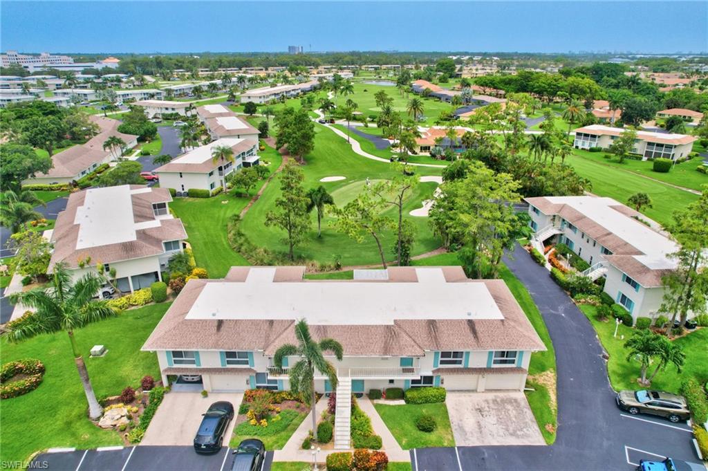 191 Quails Nest Road, Unit 1 Naples, FL 34112 - Photo 38 of 46 an aerial view of multiple houses with yard