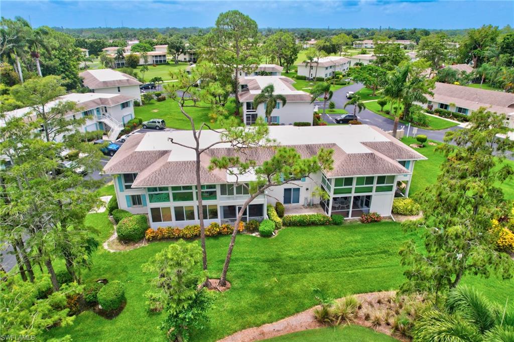 191 Quails Nest Road, Unit 1 Naples, FL 34112 - Photo 43 of 46 a view of a house with a garden