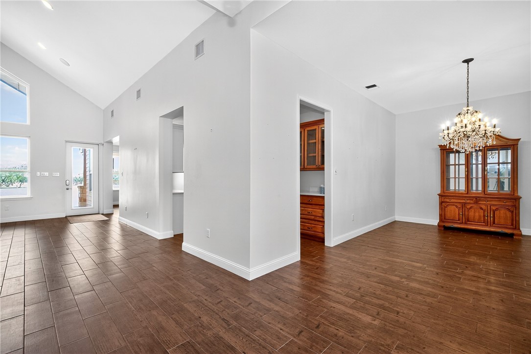 5332 Alegre Lane Robstown, TX 78380 - Photo 14 of 40 a view of an empty room with window and wooden floor