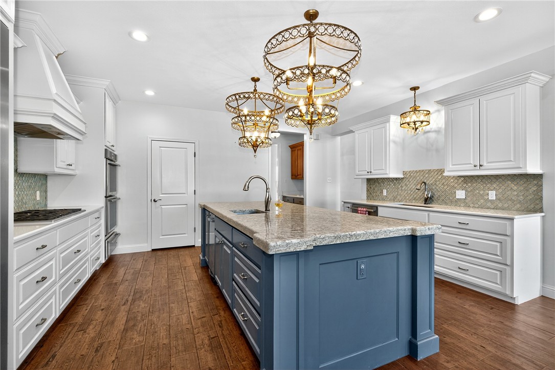 5332 Alegre Lane Robstown, TX 78380 - Photo 22 of 40 a kitchen with stainless steel appliances granite countertop a sink a stove cabinets counter space and a window