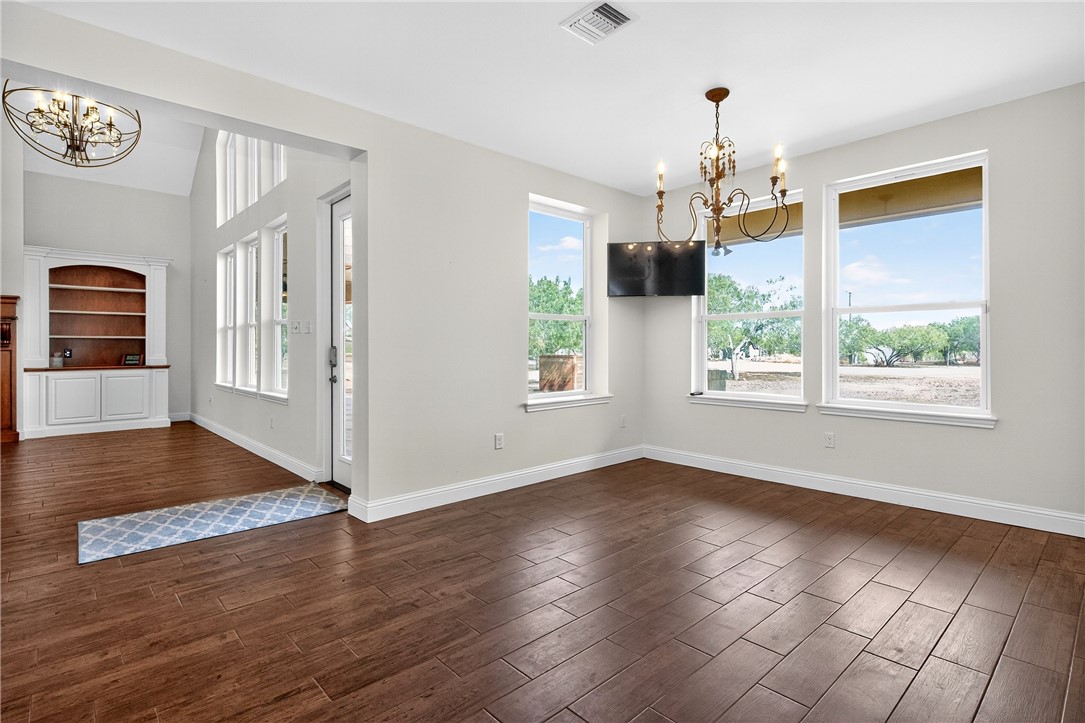 5332 Alegre Lane Robstown, TX 78380 - Photo 25 of 40 a view of a livingroom with wooden floor and a window