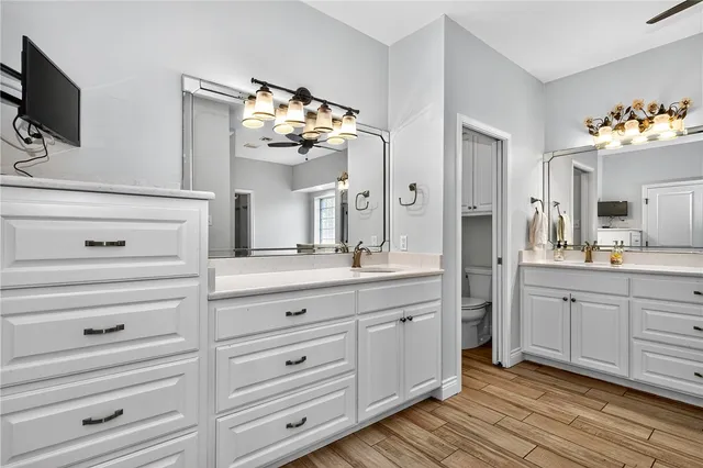 a spacious bathroom with double vanity sink and a mirror