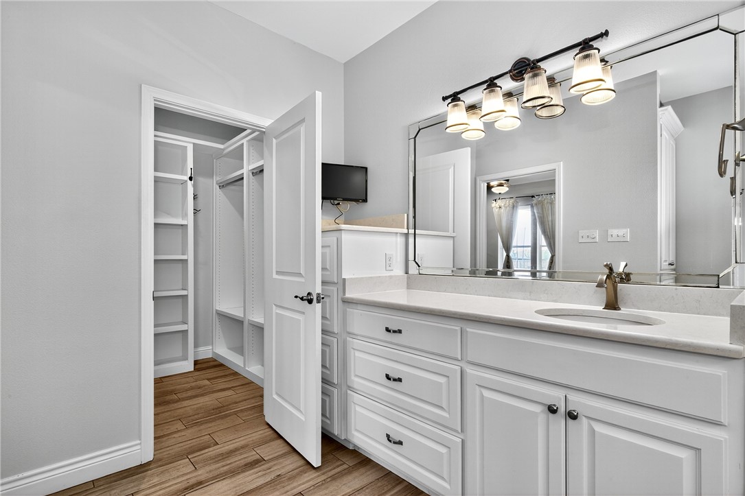 5332 Alegre Lane Robstown, TX 78380 - Photo 28 of 40 a spacious bathroom with a double vanity sink and mirror