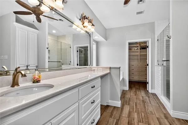 a bathroom with a double vanity sink and a mirror