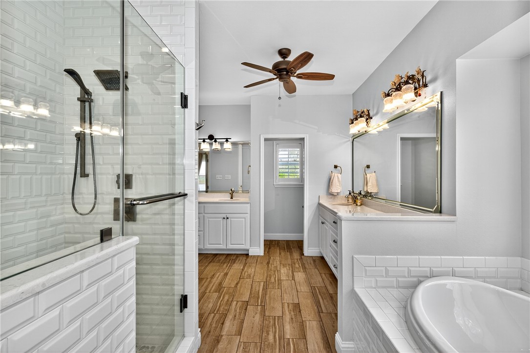 5332 Alegre Lane Robstown, TX 78380 - Photo 31 of 40 a bathroom with a sink a mirror and shower