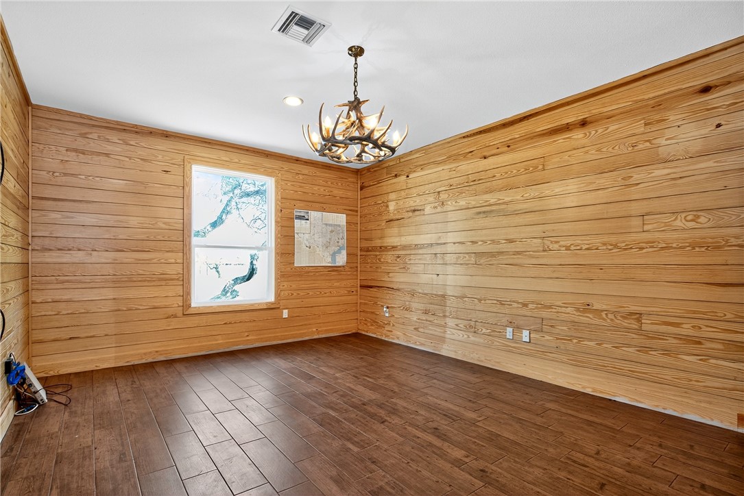 5332 Alegre Lane Robstown, TX 78380 - Photo 36 of 40 a view of empty room with wooden floor and fan