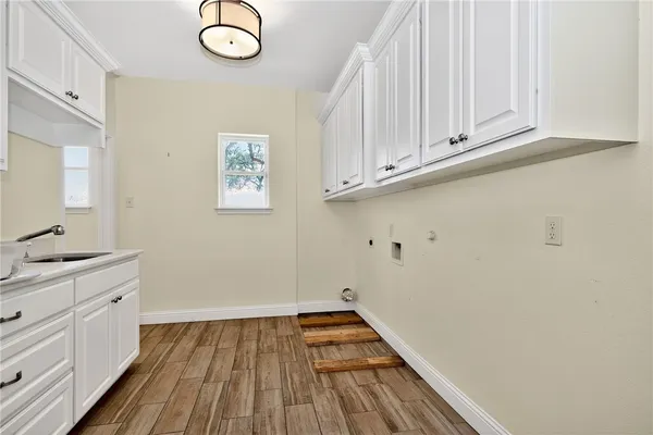 a view of cabinets and wooden floor