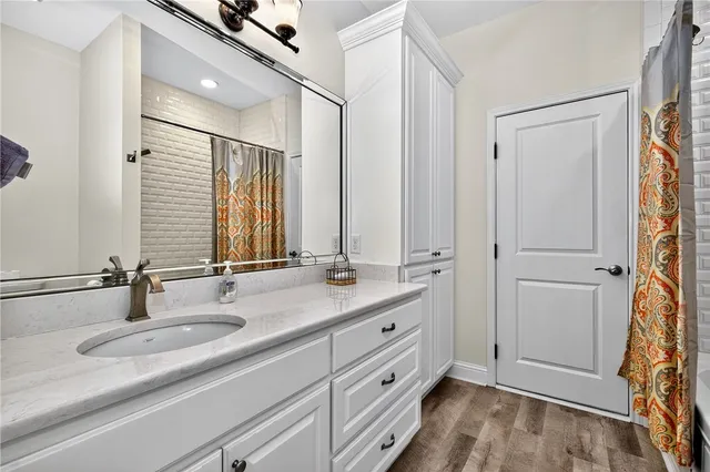a bathroom with a double vanity sink and mirror