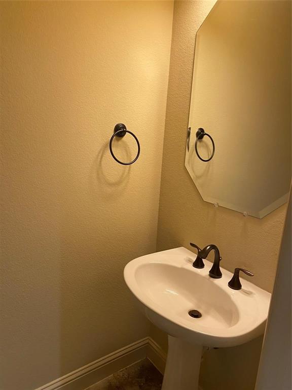 2222 Kirby Street Dallas, TX 75204 - Photo 21 of 25 Pedestal sink with oil-rubbed bronze fixtures
