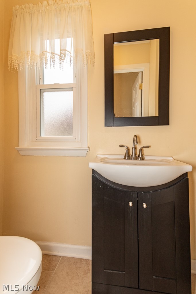 2219 Fenwick Road Cleveland, OH 44118 - Photo 25 of 32 Updated half bath on 1st floor off foyer has ceramic floor.