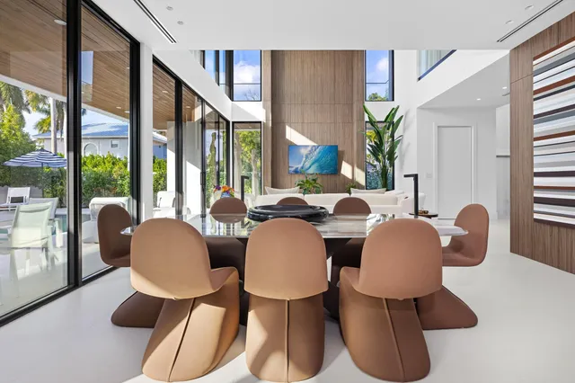 a view of a patio with swimming pool table and chairs