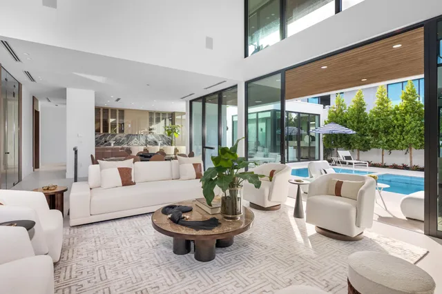 a view of a patio with a table chairs and a yard