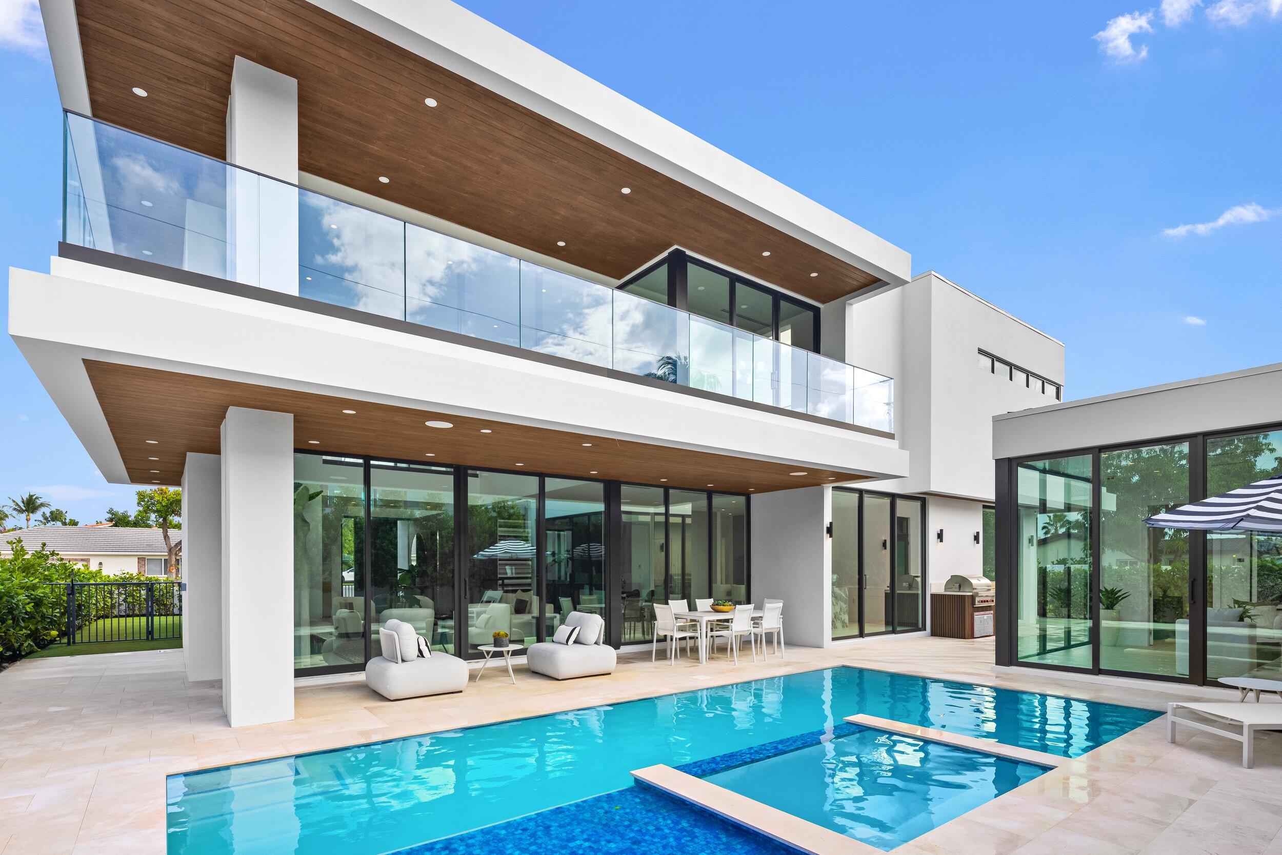 1099 Northeast 4th Avenue Boca Raton, FL 33432 - Photo 2 of 60 a view of a patio with a table and chairs