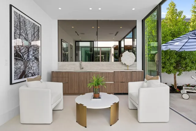 a bedroom with a large bed and large window