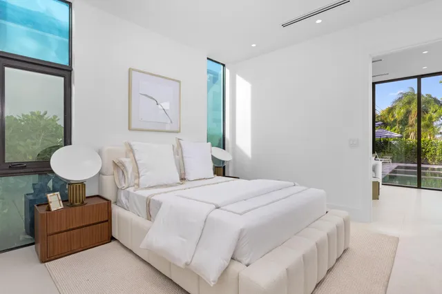 a bedroom with bed and window