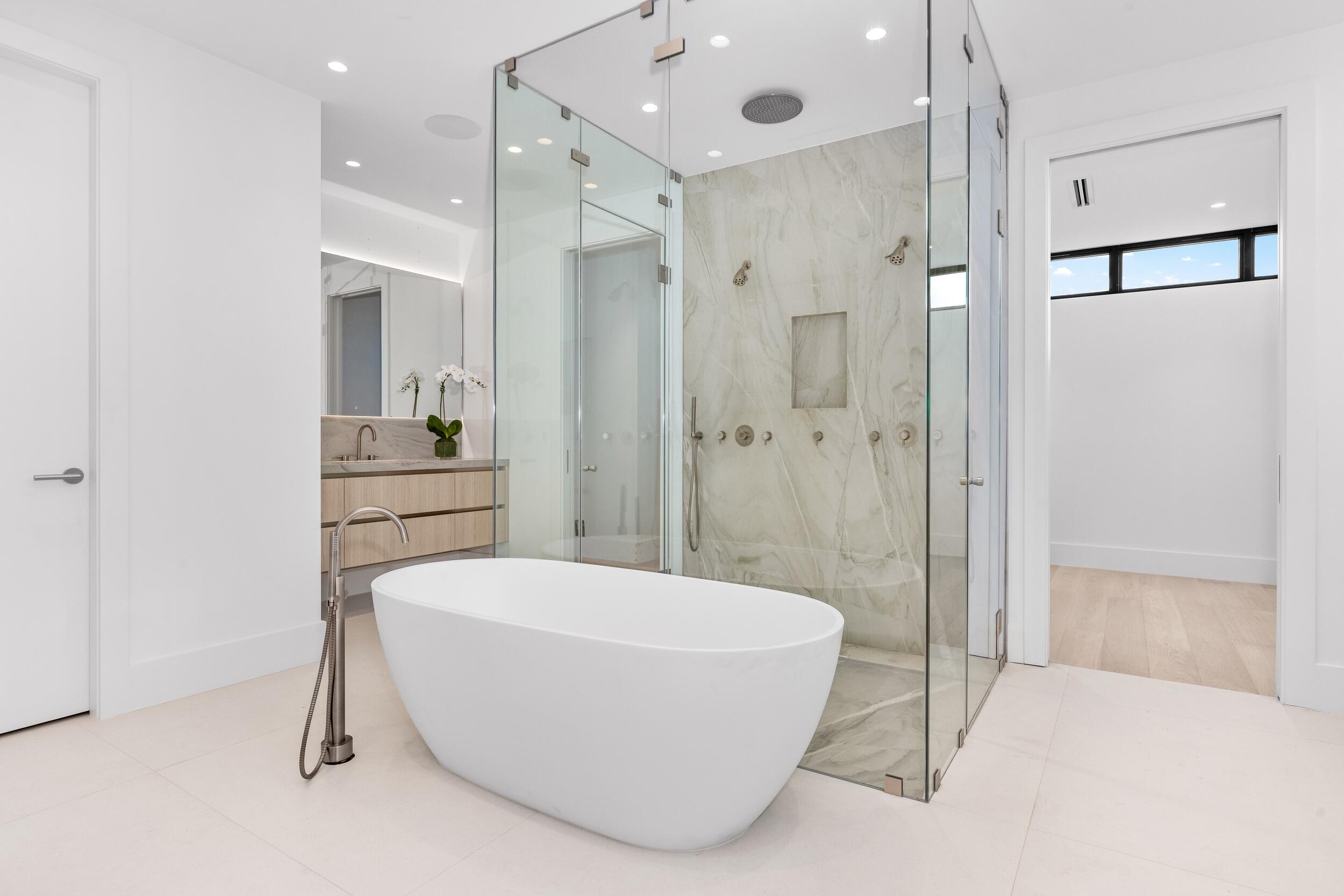 1099 Northeast 4th Avenue Boca Raton, FL 33432 - Photo 30 of 60 a bathroom with a tub shower and sink