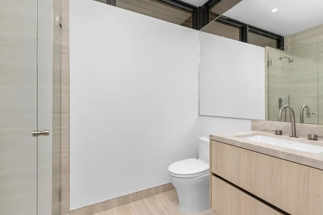 a utility room with sink dryer and washer
