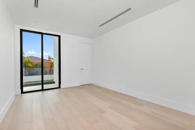 a view of an outdoor dining space with a table and chairs
