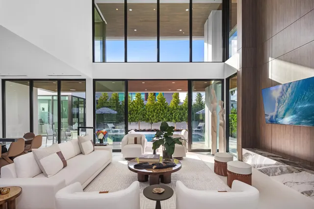 a dining room with furniture and wooden floor