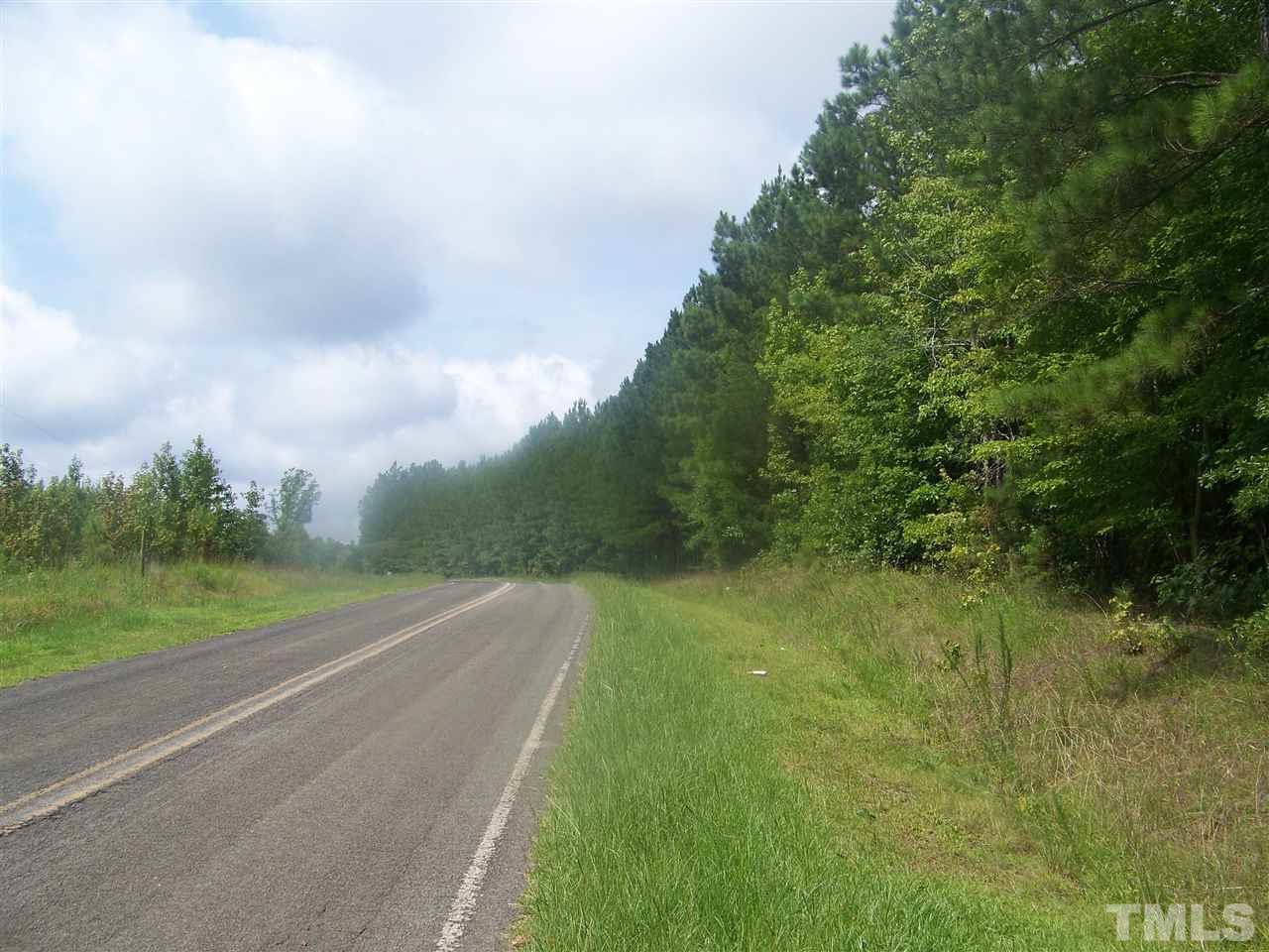 1 Roxboro Road Rougemont, NC 27572 - Photo 1 of 35 a view of a grassy field with trees