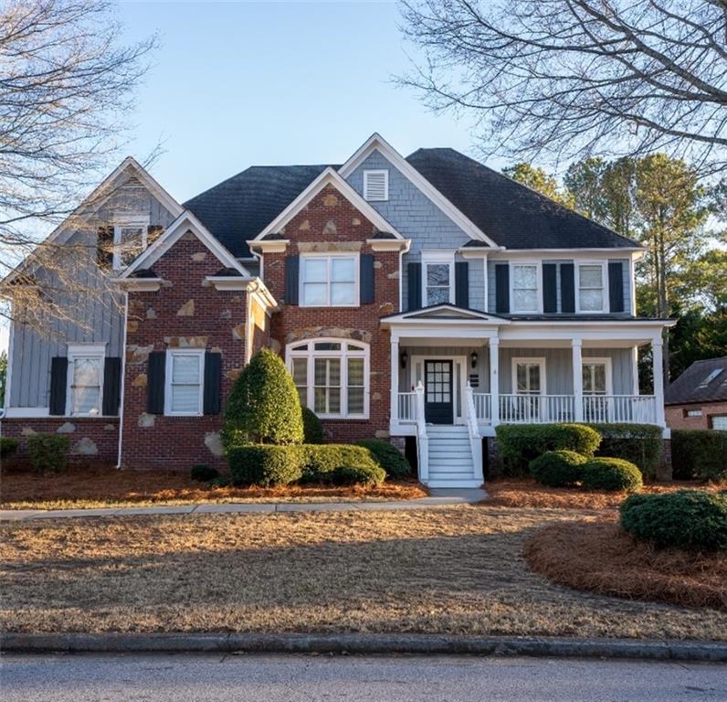 1106 Bridge Mill Avenue Canton, GA 30114 - Photo 1 of 1 a front view of a house with a yard
