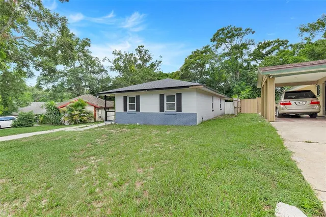 a view of a house with a back yard