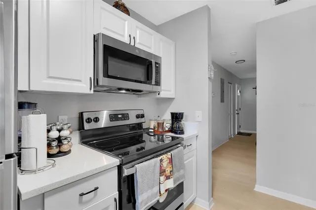 a bedroom with two beds and a window