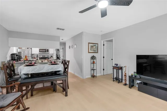 a kitchen with stainless steel appliances granite countertop a refrigerator stove and sink