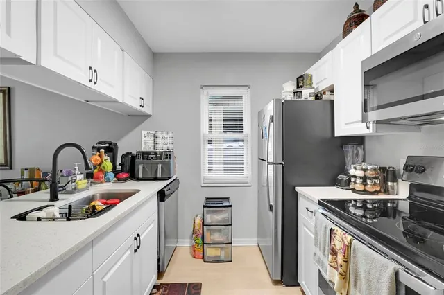 a view of a dining room with furniture and a window