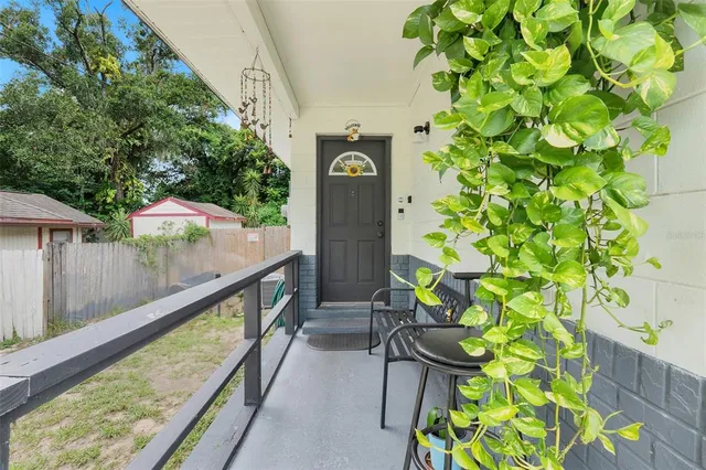 a house with green field in front of it