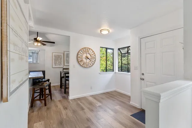 a view of a room with wooden floor