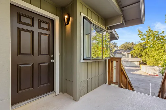 a view of balcony with furniture