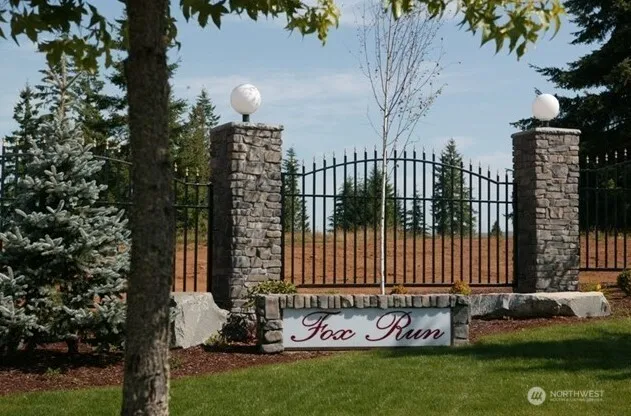 a view of a playground with basketball court